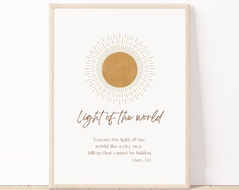 May include: A printable wall art design with a gold sun graphic and the text "Light of the world" in brown script. The text below reads "You are the light of the world, like a city on a hilltop that cannot be hidden. Matt. 5:14".