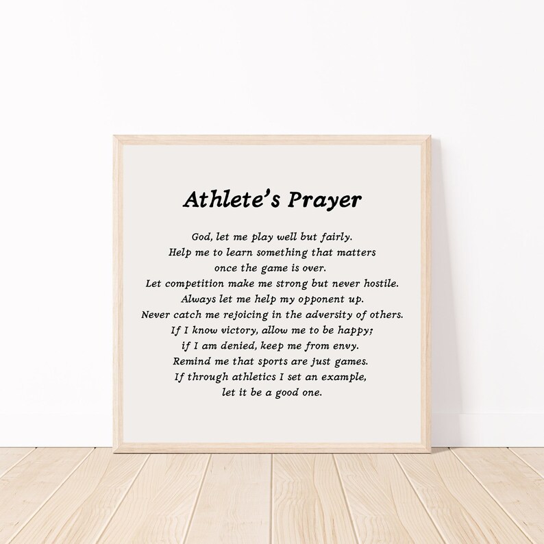 May include: A framed print with a white background and black text. The text reads "Athlete's Prayer" and includes a poem about sportsmanship and competition.