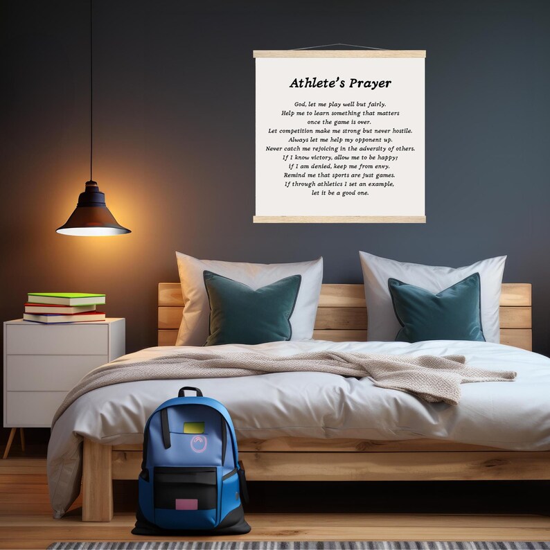 May include: A framed print with a white background and black text. The text is a poem titled "Athlete's Prayer" and includes lines like "God, let me play well but fairly" and "If through athletics I set an example, let it be a good one."