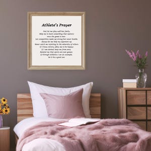 May include: A framed print with a white background and black text. The text is a poem titled "Athlete's Prayer" and includes the following lines: "God, let me play well but fairly. Help me to learn something that matters once the game is over."