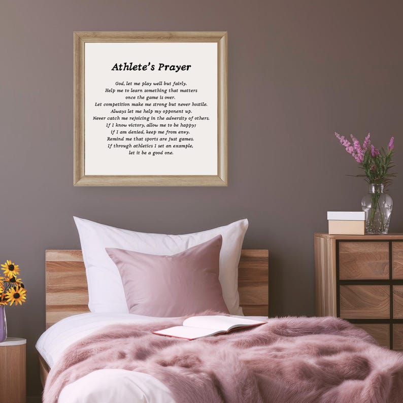 May include: A framed print with a white background and black text. The text is a poem titled "Athlete's Prayer" and includes the following lines: "God, let me play well but fairly. Help me to learn something that matters once the game is over."