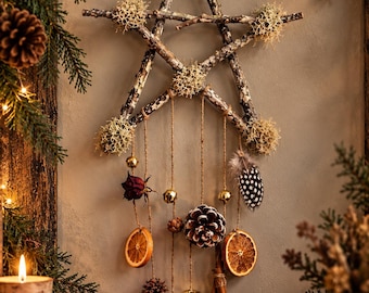 May include: A five-pointed star wall hanging constructed from natural twigs and decorated with light-colored lichen. Hanging from the star are jute strings featuring dried orange slices, a pinecone, cinnamon sticks, a dried rose, and gold bells.