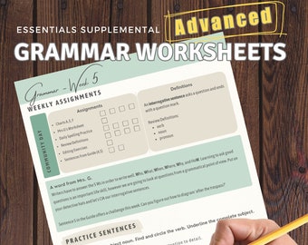 May include: A black and white worksheet with the title "Grammar - Week 5" and the text "Practice Sentences". The worksheet includes a crossword puzzle with the letters "m", "u", and "w" filled in. A hand is holding a yellow pencil over the worksheet.