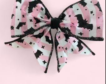 Goth pink and white stripe bat print bow with clip
