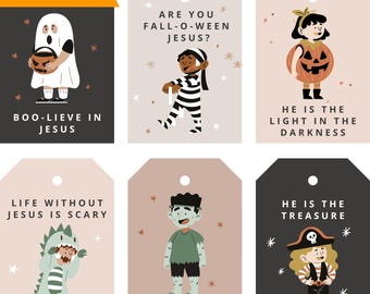 May include: A collection of Halloween-themed gift tags with cartoon illustrations and religious messages. The tags feature images of a ghost, zombie, and other characters. Text includes "Boo-lieve in Jesus" and "He is the treasure."