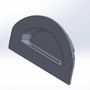Op de afbeelding: Een grijze, halfronde deurgreep van plastic met een rechthoekige opening.