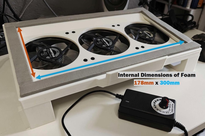 May include: White plastic box with three black fans and a gray foam lining. The internal dimensions of the foam are 178mm x 300mm.