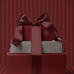 May include: A stack of wrapped gifts tied with a large burgundy satin bow. The bottom box is wrapped in burgundy striped paper, topped with a box wrapped in black and white striped paper. The background is a burgundy striped pattern.
