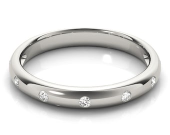 May include: A simple silver band with five small round diamonds set into the band.