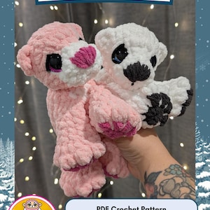 May include: Two handmade crochet bear cubs, one pink and one white, with black eyes and pink accents. The image includes the text "NANOOK the BEAR CUB" and "PDF Crochet Pattern".