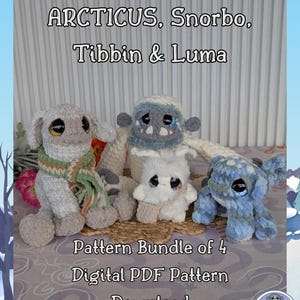 May include: Four crocheted plush toys in shades of grey, white, and blue are displayed. The toys have large eyes and are arranged on a woven mat. The image includes the text "ARCTICUS, Snorbo, Tibbin & Luma" and "Pattern Bundle of 4, Digital PDF Pattern, Download."