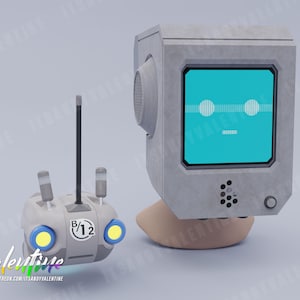 May include: A grey robot with a blue screen face and a small grey remote control with yellow lights. The robot has a round speaker grill and a button on the side. The remote control has a black antenna and a white label that says "B/12".