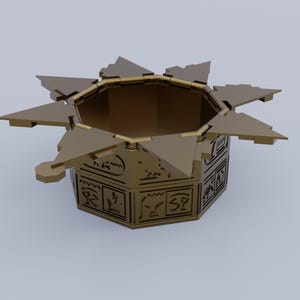 May include: A gold-colored, star-shaped, decorative box with a hexagonal base. The box is open and has intricate designs on the sides.