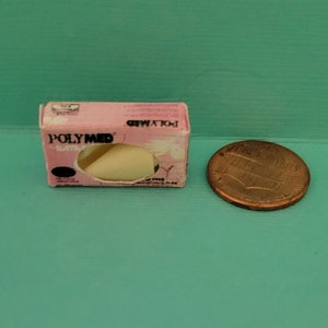 Dollhouse box of medical rubber gloves