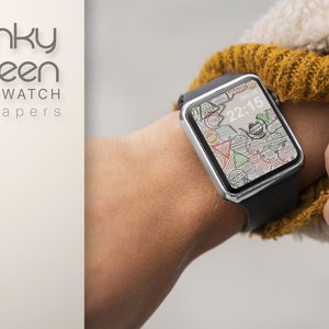 May include: A smartwatch with a black band and a white face with a colorful, abstract design. The time is 22:15. The watch is on a person's wrist.