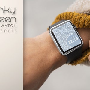 May include: A smartwatch with a black band and a white and blue patterned watch face. The watch face displays the time as 22:15 and the day as THU 29.