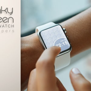 May include: A white smartwatch with a geometric pattern wallpaper on the screen. The time is displayed as 22:15 and the date is shown as THU 29.