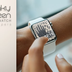 Puede incluir: Un smartwatch blanco con una esfera de reloj con un patr&oacute;n en blanco y negro que presenta una mano con l&iacute;neas y una estrella. La esfera del reloj tambi&eacute;n muestra la fecha y la hora, "THU 29" y "02:15".