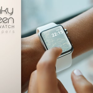 May include: A silver smartwatch with a white band displays a decorative screen with the time 22:15. The watch is on a wrist, and the text "Funky Screen SMARTWATCH wallpapers" is in the upper left corner.