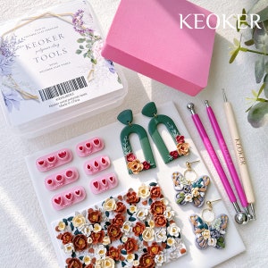 May include: A set of polymer clay tools for making earrings and other jewellery. The set includes a variety of moulds, tools, and a pink foam block. The tools are labelled "Keoker Petal Polymer Tools" and "Made in China".