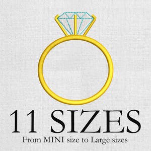 May include: A gold ring with a large, light blue diamond-shaped gem. The ring is embroidered on a white fabric. The text "11 SIZES" is below the ring, with "From MINI size to Large sizes" underneath.