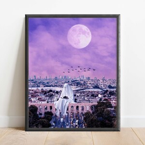 May include: A white figure sits on a rooftop overlooking a city skyline with a large pink moon in the sky. The city is bathed in a purple light and there are birds flying overhead.