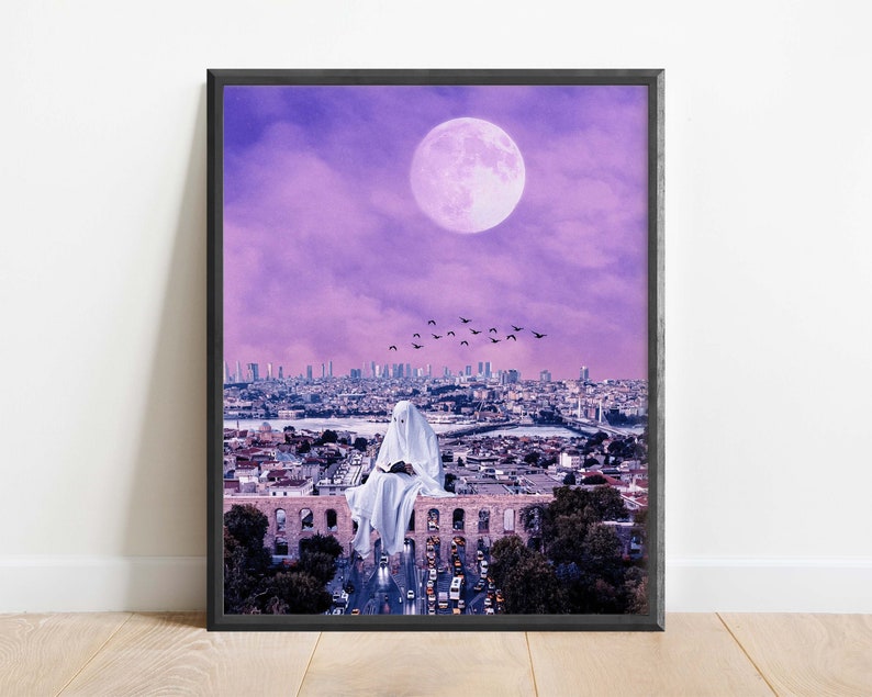 May include: A white figure sits on a rooftop overlooking a city skyline with a large pink moon in the sky. The city is bathed in a purple light and there are birds flying overhead.