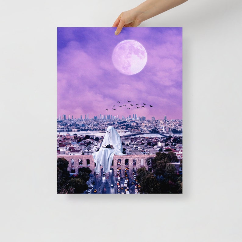 May include: A white figure wearing a sheet sits on a stone wall overlooking a city skyline. The city is bathed in a purple light, and a large, pink moon hangs in the sky. A flock of birds flies overhead.
