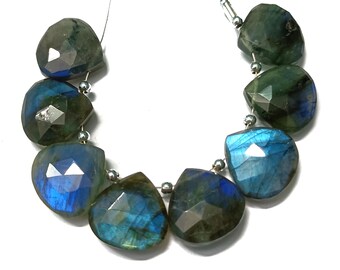 May include: A strand of faceted labradorite gemstone beads in shades of green and blue. The beads are strung on a silver wire and are ready to be made into jewellery.