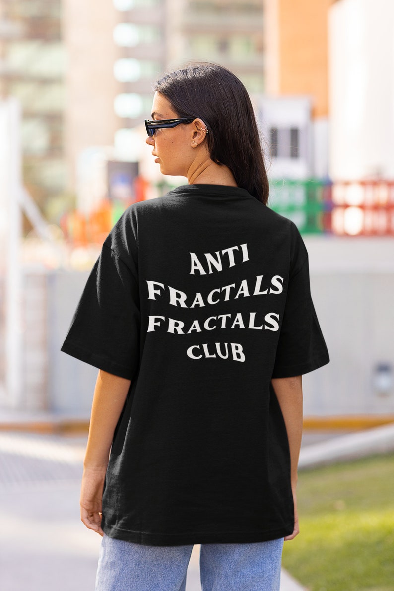 May include: Black t-shirt with white text that reads "ANTI FRACTALS FRACTALS CLUB".