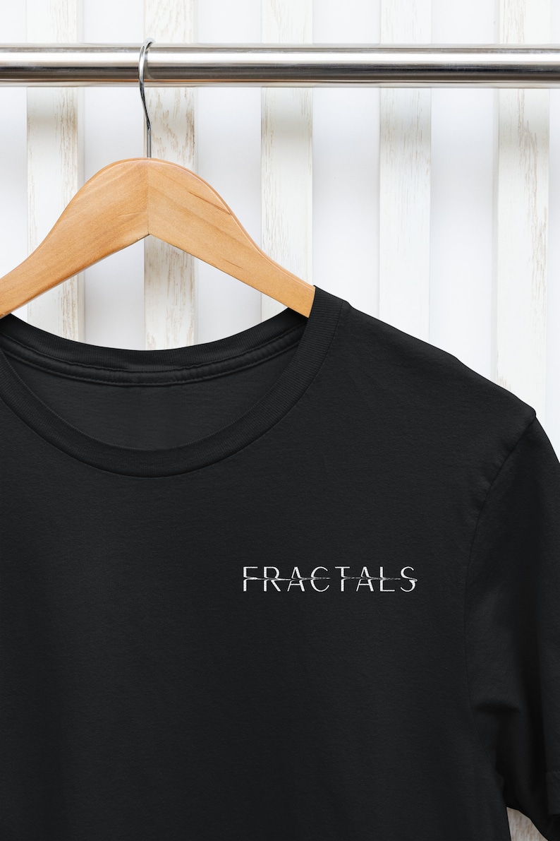May include: Black t-shirt with the word "FRACTALS" printed in white on the front.