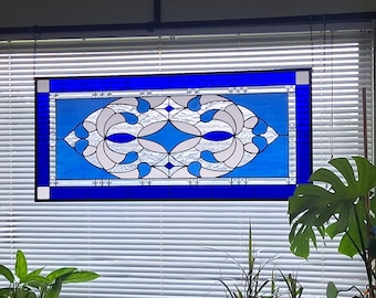 Stained glass panel featuring a cobalt blue contemporary star design, measuring 40.75 by 18.75 inches.