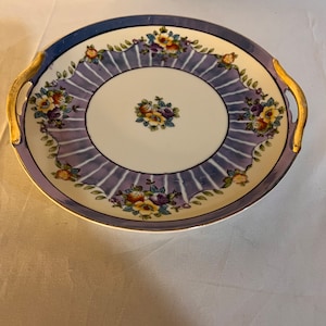 Beautiful 1920’s noritake plate, with handles. Made in Japan with cherry blossom backstamp