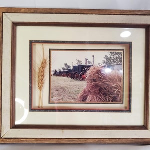 One of a kind, wheat tractor picture. Shadow box type frame with wheat from the photograph in the frame, photo/signed elsi Macklin