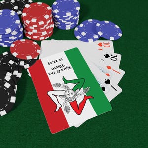 May include: A playing card featuring a green, white and red flag of Sicily. The card is labelled "Year & Time, Theberto, 12-2-52". The card is surrounded by poker chips.