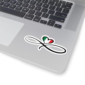 May include: A white sticker with a black infinity symbol and a heart-shaped Italian flag design. The sticker is on a silver laptop, with the keyboard in the background.