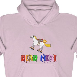 May include: A pink hoodie with a rainbow colored graphic of a unicorn wearing a rocket pack and roller skates. The text "DEAD MEAT" is written below the unicorn in rainbow colors.