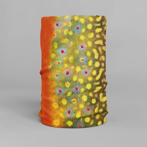 May include: A brown, yellow, and blue patterned neck gaiter with a fish scale design.