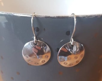 Sterling silver floral disc earrings.