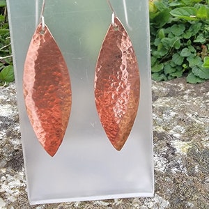 Copper hammered leaf earrings with sterling silver French hooks.