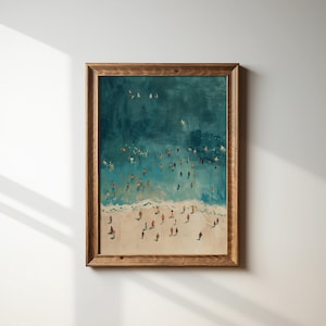 May include: A framed painting of a beach scene with a teal blue ocean and white sand.  Many small figures are scattered across the beach and in the water.