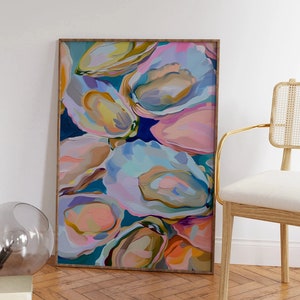 May include: Abstract painting of colorful oyster shells in shades of pink, blue, green, and yellow. The painting is framed in a natural wood frame.