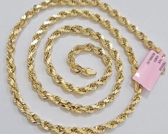 May include: Three gold rope chains of different lengths. The chains are laid out in a circle on a white background. The largest chain is 24 inches long, the middle chain is 20 inches long, and the smallest chain is 18 inches long. The chains are all made of 10k gold.