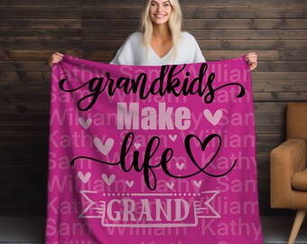 May include: Pink fleece blanket with the text "Grandkids Make Life Grand" in black lettering with pink hearts. The text is repeated in a smaller font size throughout the blanket.
