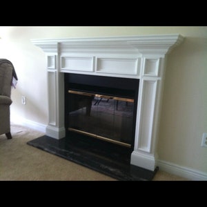 Raised panel fireplace mantle surrounds