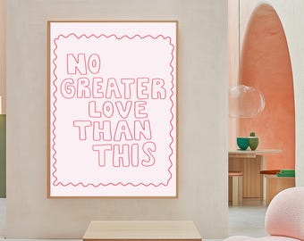 May include: A framed print with a white background and pink text that reads "NO GREATER LOVE THAN THIS". The text is outlined in a wavy pink line.