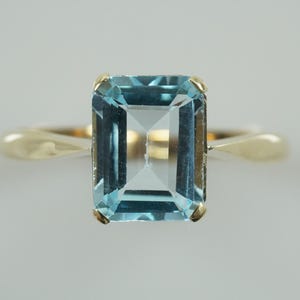Magnificent Emerald cut Blue Topaz Ring 9ct Gold