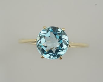 Classic brilliant cut blue Topaz ring in 9ct