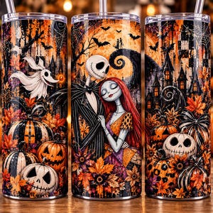May include: A cylindrical tumbler with a metal straw featuring a colourful Halloween-themed print. The design includes Jack Skellington and Sally, a ghost dog, carved pumpkins, autumn leaves, bats, and a dark castle against a full moon background.