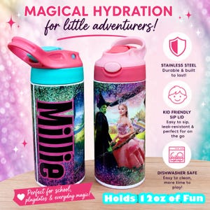 May include: Two stainless steel water bottles with pink and teal lids. One bottle has the name "Millie" in large letters. The other bottle features a scene with a green-skinned character and a woman in a pink dress. The bottles hold 12 oz of liquid.